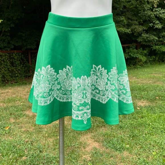 San Souci scuba material skater skirt, lace print over green size S NWT - Picture 1 of 5
